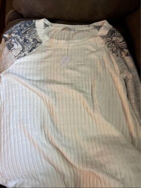 Large Boutique brand Ces Femme White Ribbed Knit Top with Black Floral Accent